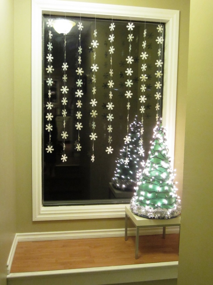Beautiful-hanging-Christmas-decorations-with-mini-Christmas-tree-beautified-with-ornamental-lighting-