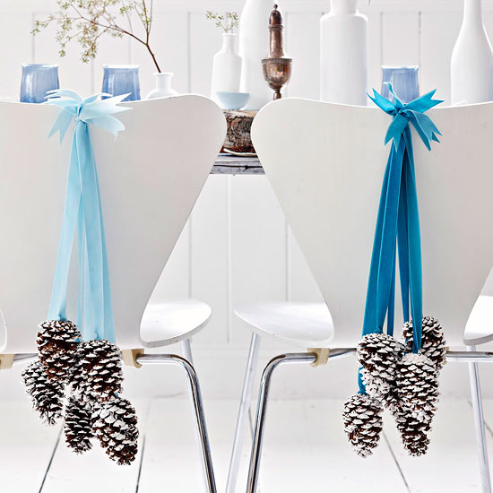 Christmas-decorating-ideas-for-small-spaces-dining-chairs-cones-and-ribbons.