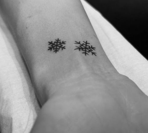 Small-black-snowflake-christmas-tattoo