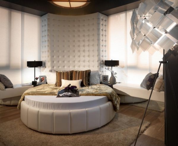 Antique-decor-and-a-round-bed-combine-to-create-a-modern-bedroom.