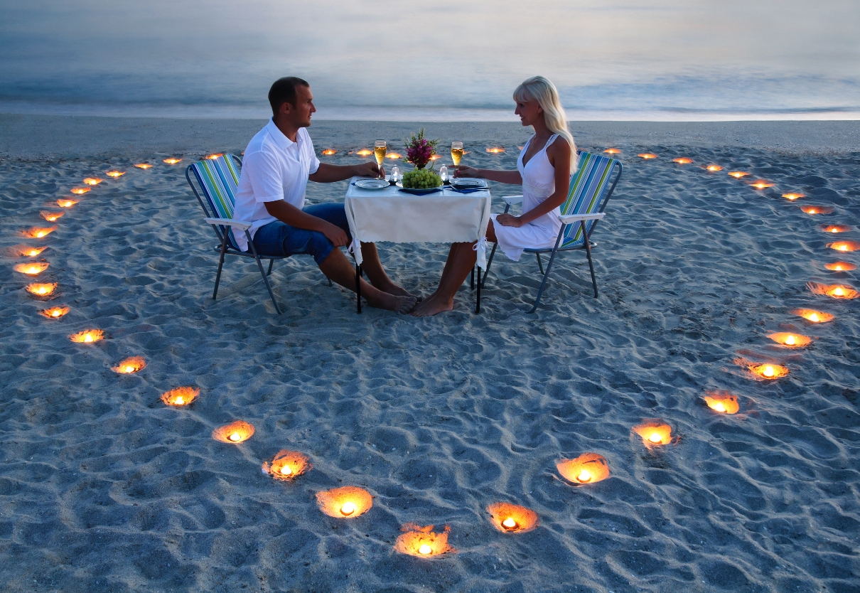 -Couple-with-Heart-Candles-on-Beach