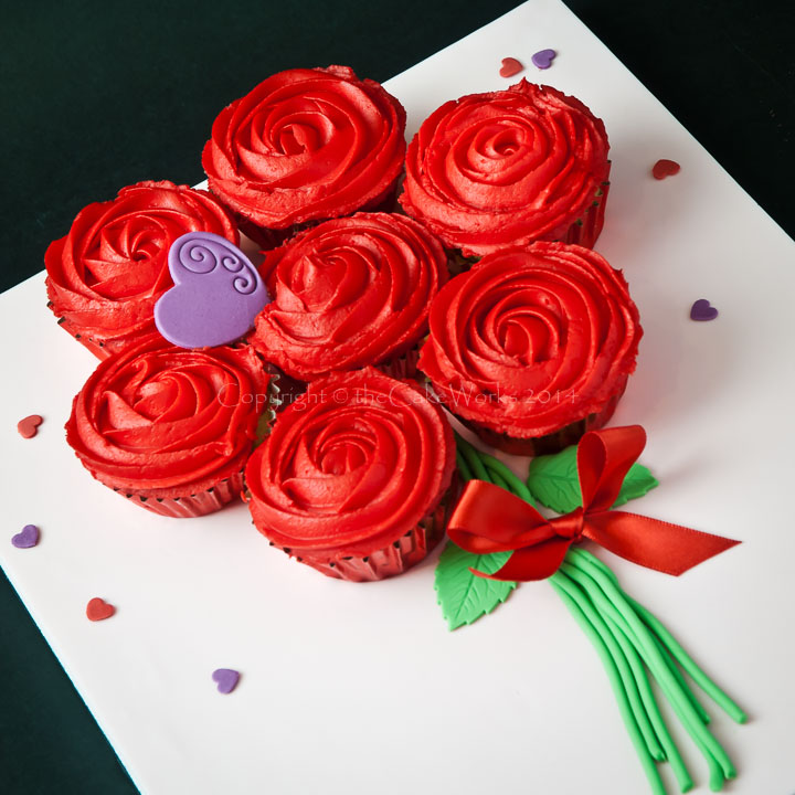 Delicious red butter iced roses as a bouquet of cupcakes