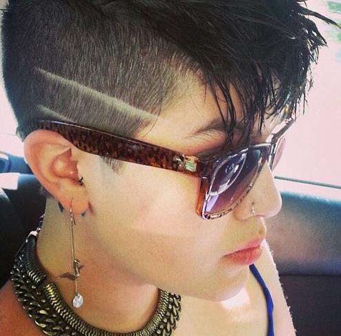 A-beautiful-latina-woman-with-an-undercut-hairstyle-and-a-razor-shaved-haircut-design-on-the-side-of-her-head.