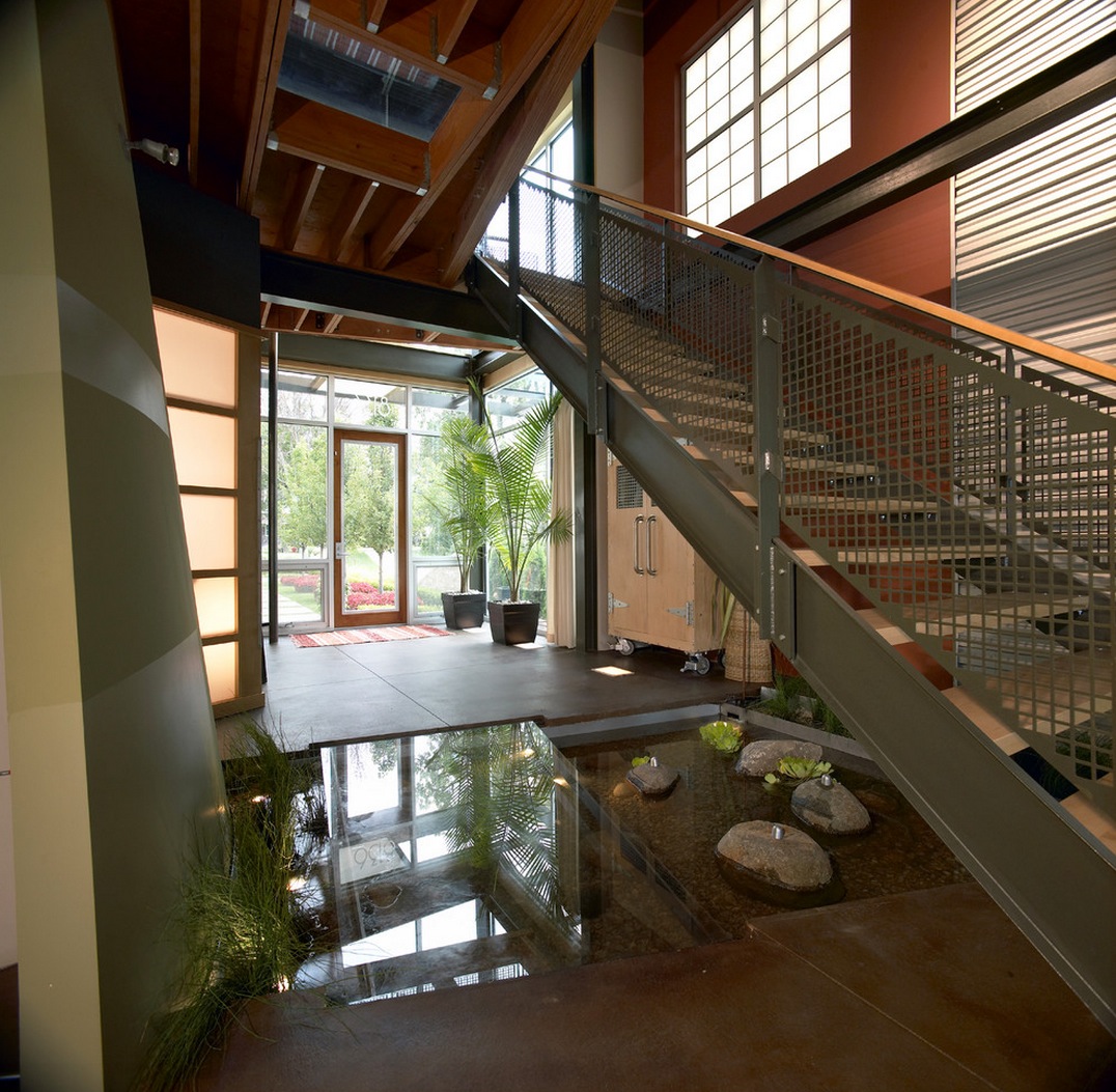 Azdarch-indoor-water-feature-pond-below-stairs-with-glass-floor