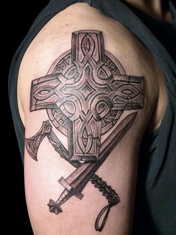 grey-ink-cross-and-weapons-tattoo-on-right-half-sleeve