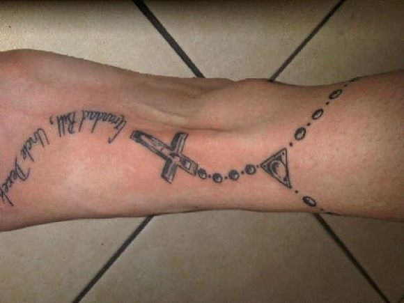 grey-ink-rosary-cross-tattoo-on-foot