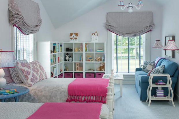 pink-and-blue-girl-room-fringe-throw-blue-skirted-sofa-gray-roman-shade-