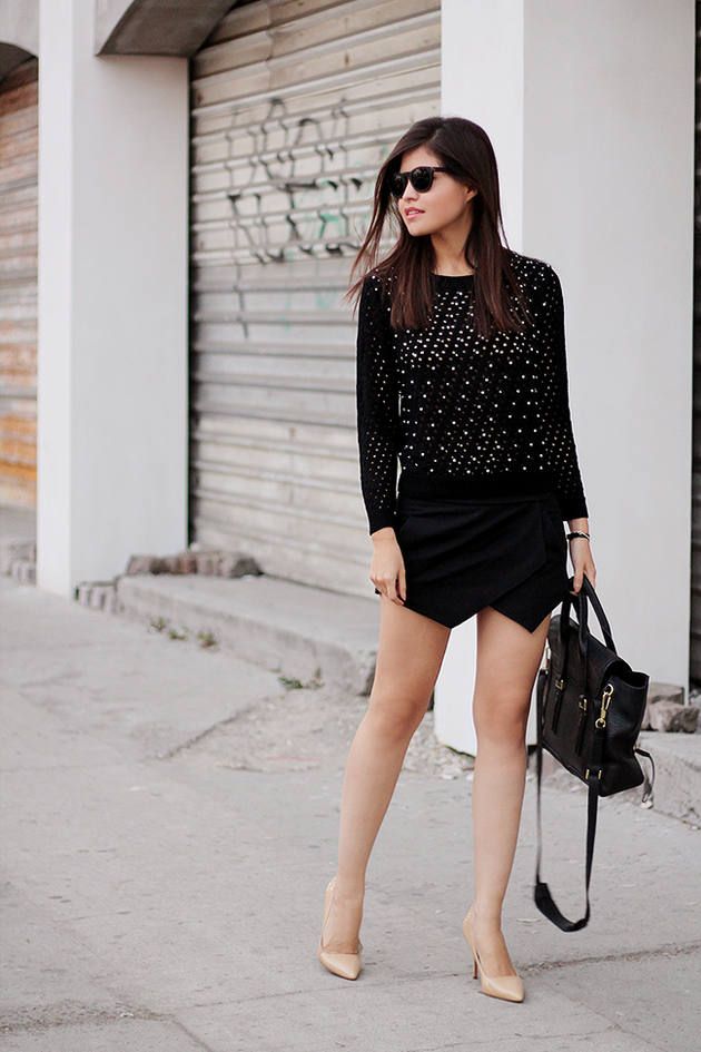 black-envelope-skort-paired-with-a-sweater-and-heels.