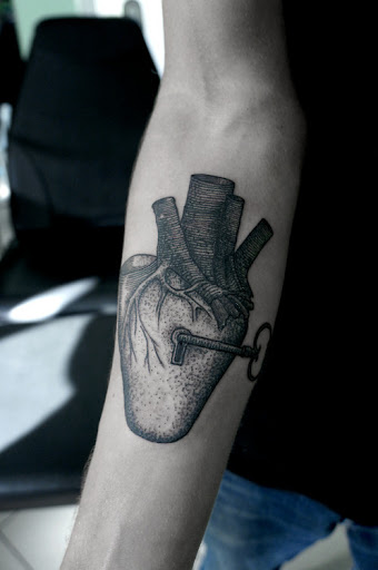 Very-famous-heart-and-lock-tattoo-design-on-inner-forearm.